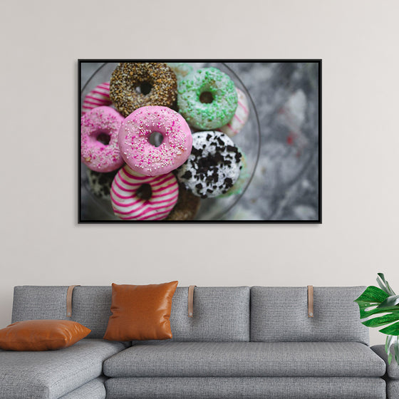 "Plate of colorful donuts"
