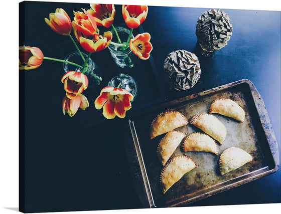 Immerse yourself in the warm, inviting ambiance of “Homemade Baked Puffed Pies,” a limited edition print that captures the essence of cozy, homey comfort. Each pie, golden-brown and perfectly crimped, is a testament to the art of baking - an intimate dance of flour, butter, and filling. The vibrant tulips add a touch of spring freshness, their petals echoing the flaky layers of the pies.