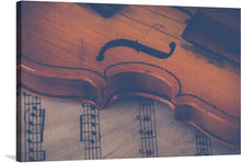  “Violin with Sheet Music”: Immerse yourself in the harmonious blend of music and artistry with our exclusive print. This exquisite piece captures the soulful elegance of a finely crafted violin, its rich wooden textures and curves gracefully juxtaposed against the structured beauty of musical notes on aged sheet music. Every line, every detail, is a sonnet; a visual melody that dances across the canvas, inviting viewers into a symphony of visual splendor. 