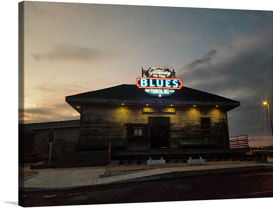 This vibrant neon sign, bathed in the warm glow of the setting sun, beckons you to the heart of the blues: Tunica, Mississippi. The words "Gateway to the Blues" blaze in electric blue and red, promising an immersive journey into the rich musical history of the region.