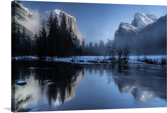 This exquisite print, titled “Yosemite Valley, United States,” captures the serene beauty of a tranquil winter morning at Yosemite National Park. The artwork features the majestic El Capitan and Half Dome, veiled in mist, their snow-capped peaks echoing the silence of the season. The reflective waters, punctuated by the delicate frost-kissed foliage, invite a moment of peaceful contemplation. 