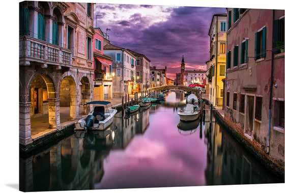 This beautiful photograph captures the magic of Venice at dusk. The Grand Canal is bathed in golden light, and the gondolas bob gently on the water. The photograph is a perfect blend of natural beauty and architectural grandeur.