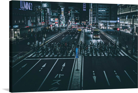 Crowded Tokyo Crosswalk”: Immerse yourself in the dynamic energy of city life with this captivating artwork. The print captures a bustling Tokyo intersection at night, where the glow of neon signs illuminates a crowd of pedestrians mid-stride, painting a vivid scene of urban vibrancy and motion. 