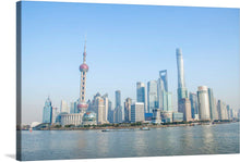  This exquisite print captures a panoramic view of Shanghai’s skyline, where modern architecture meets the tranquil waters. The iconic Oriental Pearl Tower stands tall, epitomizing human ingenuity and architectural prowess. The calm waters in the foreground reflect the towering structures, offering a harmonious blend of urban development and natural elegance.