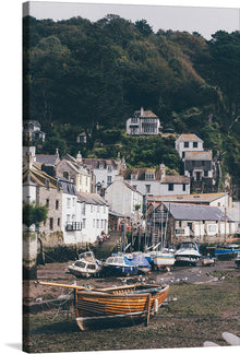  “Plockton Village, Scotland” captures the serene beauty of a quaint coastal village nestled amidst lush greenery. The artwork transports you to a world where charming white cottages with slate roofs are perched harmoniously alongside the tranquil harbor. Boats, moored and waiting, add a touch of maritime elegance. Every brushstroke invites you to experience the peaceful pace of life in Plockton, where nature and architecture exist in perfect harmony. 