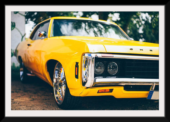 "Close Up of a Vintage Yellow American Car"