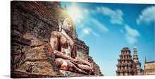  Immerse yourself in the serene tranquility of our “Buddha” art print. This exquisite piece captures the majestic presence of a Buddha statue, exuding an aura of peace and enlightenment, set against the backdrop of an ancient temple under the radiant sun. The intricate detailing on the statue and the harmonious blend of warm tones will transform your space into a sanctuary of calmness and reflection. 