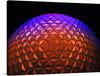 Illuminate your space with the mesmerizing glow of this exclusive art print, capturing the iconic geodesic sphere bathed in a symphony of vibrant hues. Each triangular facet dances with color, transitioning seamlessly from a warm amber glow to the tranquil embrace of lilac and violet. This artwork, a harmonious blend of architecture and light, promises to be a captivating centerpiece that ignites conversation and admiration in any modern living space. 