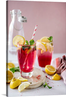  “Fizzy red lemonade soda” is a beautiful print that captures the essence of summer. The print features a tall glass of red lemonade soda with a lemon wedge and mint leaves on top. 