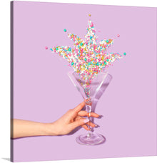 Elevate your home bar with this stunning print of a hand holding a martini glass with sprinkles in it. The vibrant colors and intricate details of the sprinkles will add a touch of whimsy to any space. Hang it in your kitchen or dining room to inspire your next cocktail creation. Cheers to good taste!