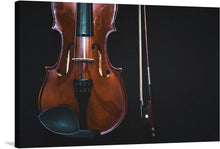  This beautiful print of a violin and bow is a perfect addition to any music lover’s collection. The rich colors and striking contrast make this piece stand out, while the close-up view of the instrument adds an intimate touch. The photo-realistic image showcases a rich brown violin with a glossy finish and a black bow with a silver tip and white hairs. 