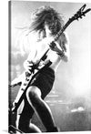 This black and white photograph of Dimebag Darrell, the legendary guitarist of Pantera, is a must-have for any fan of heavy metal. In this image, Dimebag Darrell is performing live at The Bayou in Georgetown, Washington, DC, on the Cowboys from Hell tour.