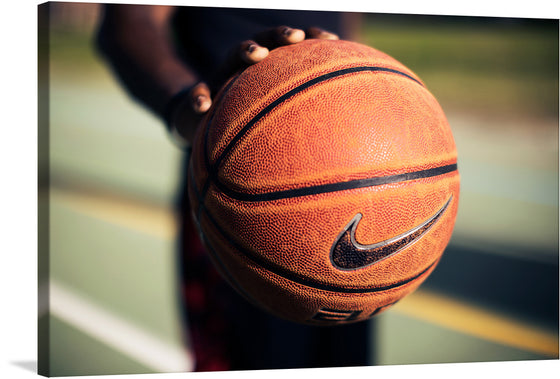 “Palming a Basketball” is a captivating print that captures the essence of the sport in a single, powerful moment. The artwork showcases an up-close view of a player’s hand skillfully gripping a basketball, highlighting the intricate textures of both the skin and the ball.