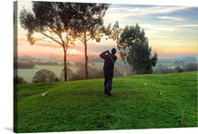  “Golfer at Sunset” captures the serene moment of a golfer, silhouetted against the breathtaking canvas of a sunset. The artwork immortalizes that perfect swing, where time seems to stand still and all that exists is the golfer, the ball, and the fading embrace of the sun. The lush greenery of the golf course contrasts beautifully with the warm hues of sunset, offering a visual spectacle that is both vibrant and tranquil. 