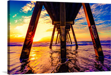  Immerse yourself in the serene beauty of a golden sunset with this exquisite print. The artwork captures a tranquil moment beneath a sturdy pier, where the harmonious dance of light and shadows unveils nature’s masterpiece. Waves gently kiss the shores, reflecting the sun’s radiant hues of amber and sapphire. This piece promises to infuse any space with warmth, tranquility, and the enchanting allure of an oceanic paradise. 