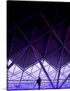 Dive into the enigmatic allure of this mesmerizing artwork, a print that encapsulates the dance between human innovation and the ethereal beauty of natural light. A solitary figure stands amidst an architectural marvel, where geometric lines converge to create a symphony of structure and space. Bathed in an otherworldly purple glow, every angle and shadow invites you on a journey of introspection and wonder. 