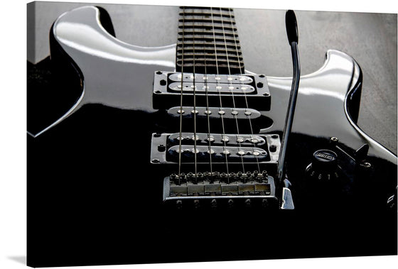 This gorgeous black and white print of an electric guitar is a must-have for any music lover or art collector. The guitar is depicted in a close-up view, with its intricate strings and metal hardware highlighted by the stark contrast between the black and white.