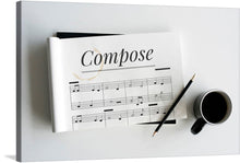  “Compose” is a beautiful print that would make a great addition to any music lover’s home. The print features a sheet of music with the word “Compose” written in a modern script font. The print is accented with a pencil and a cup of coffee, making it perfect for a home office or music room.
