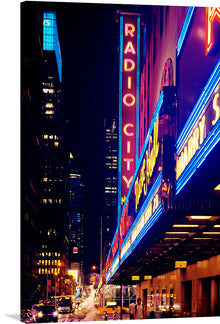  Immerse yourself in the vibrant energy of New York City with this exquisite print capturing the iconic Radio City Music Hall. Bathed in the mesmerizing glow of neon lights, the artwork encapsulates the city’s ceaseless dynamism and illustrious charm. Every detail, from the bustling street life to the towering architectural marvels, is rendered with impeccable clarity - inviting you into a world where artistry and urban vitality converge. 