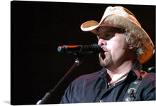  “Country music singer Toby Keith” is a beautiful print that captures the essence of country music. The image showcases the singer in his element, performing on stage with his signature cowboy hat. 