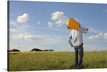  “Man Carrying Guitar” is a stunning piece of art that captures the essence of music and nature in perfect harmony. This black and white print features a man walking through a vast open field, carrying a guitar on his shoulder. The guitar is a symbol of the universal language of music that connects us all, while the serene landscape evokes a sense of peace and freedom.