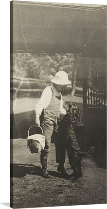  Experience the timeless charm of “Elizabeth and Inky” by Alfred Stieglitz. This black and white photograph captures a heartwarming moment between a young girl and her dog, embodying the innocence of childhood and the special bond between a child and their pet.