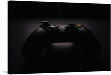  The juxtaposition of the controller's intricate details against the moody backdrop creates a captivating visual narrative, highlighting the essence of gaming as both an art form and a source of immersive entertainment. The subtle play of light on the controller's contours adds a touch of mystery and sophistication to the image, making it an ideal addition to any gaming enthusiast's space. 