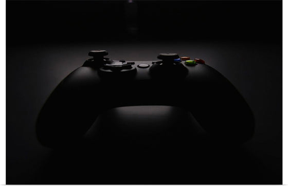 "A Dark Background Photograph of an Xbox Controller"