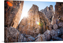  “Cortina d’Ampezzo, Italy” is a stunning print that captures the natural beauty of the Italian Alps. The image showcases the rugged mountain peaks, with the sun shining through the rocks, creating a beautiful and dramatic scene.