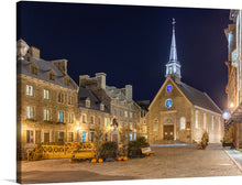  Wilfredo Rafael Rodriguez Hernandez’s “Place Royale at Night, Vieux-Québec, Quebec Ville, Canada” is a stunning print that captures the essence of a historic square under the gentle embrace of nightfall. The cobblestone paths, illuminated by the soft glow of street lamps, invite you on a tranquil journey through time. 