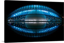  “L’Hemisferic, Valencia, Spain” is a limited edition print that captures the architectural masterpiece that is a crown jewel of Valencia. The artwork depicts “L’Hemisfèric” at night; a stunning architectural structure located in Valencia, Spain. The building is illuminated by radiant blue lights that highlight its unique elliptical shape.