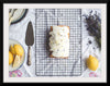 "Freshly baked lemon cake with icing and lavender flowers"