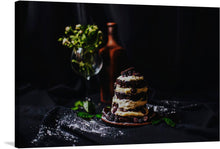  This stunning print features a decadent chocolate cake with blackberry, set against a dark cloth and a black background. The wine glass with leaves and red bottle add a touch of sophistication and elegance to the image. 