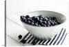 “Blueberries in a white ceramic bowl” by Monika Grabkowska is a beautiful print that would make a great addition to any home. The print features a white ceramic bowl filled with plump, fresh blueberries. The contrast between the blueberries and the white bowl is striking, making this print a perfect statement piece for any room.