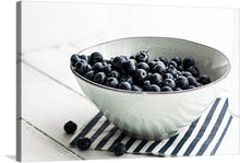  “Blueberries in a white ceramic bowl” by Monika Grabkowska is a beautiful print that would make a great addition to any home. The print features a white ceramic bowl filled with plump, fresh blueberries. The contrast between the blueberries and the white bowl is striking, making this print a perfect statement piece for any room.
