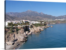  This artwork, titled “Nerja vue depuis le balcon d’Europe,” is a stunning representation of the picturesque town of Nerja, as viewed from Europe’s balcony. The artwork captures the essence of Nerja’s natural beauty, with its rugged cliffs, azure waters of the Mediterranean Sea, and majestic mountains. 