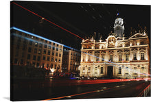  “Place des Terreaux, Lyon, France.” This artwork captures the iconic square bathed in the warm glow of architectural lighting, showcasing the intricate details of the majestic City Hall. The vibrant red and blue light streaks add a dynamic element, painting a scene where history and modernity converge. Every brushstroke captures the ethereal quality of light with unmatched precision, immersing your space in an ambiance of sophistication and tranquility.