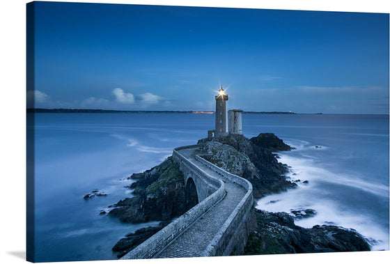 Illuminate your space with the serene beauty of this exquisite print, capturing the majestic lighthouse standing tall against the tranquil backdrop of a dusky sky and calm sea. The artwork encapsulates a moment where nature and architecture converge in harmonious existence, offering a visual retreat into peace and solitude. 