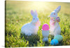 “Easter eggs & bunny” is a beautiful print that captures the essence of Easter. The print features two white bunnies with colorful scarves and Easter eggs scattered around them. The bunnies are sitting on their hind legs and facing each other. 