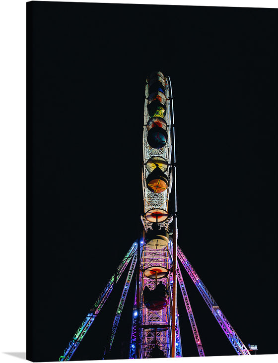 “Night Wheel - Clermont-Ferrand, France” is a captivating artwork that captures the mesmerizing allure of a Ferris wheel illuminated against the tranquil backdrop of the night sky. The intricate lattice structure of the wheel is accentuated by strategic lighting, casting intricate shadows and highlights that dance across the canvas. 