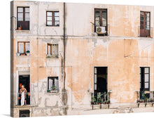 This beautiful print of Cagliari, is a captivating and enchanting work of art. The print depicts a rundown building with windows, balconies, and a person standing outside on a balcony. The artist has used a soft, muted palette to create a sense of serenity and peace. The color of the building is perfectly balanced, and the overall effect is calming and harmonious.
