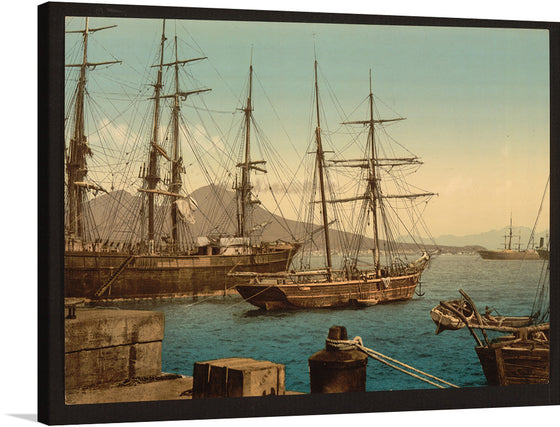 Adorn your space with the serene beauty of this exquisite print, capturing a timeless scene of majestic ships at rest in a tranquil harbor. The artwork, rich in detail and color, transports viewers to an era where the sea was the gateway to distant lands and untold adventures. The intricate rigging of the tall ships, silhouetted against a backdrop of distant mountains and a serene sky, evokes a sense of wanderlust and the romantic allure of seafaring journeys. 