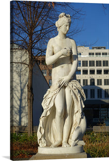  Immerse yourself in the elegance and grace of this exquisite print, capturing a timeless piece of artistry. The statue, a harmonious blend of strength and beauty, stands majestically against an urban backdrop. Every curve, every detail, rendered with meticulous craftsmanship, invites viewers into a world where art and humanity intertwine. 