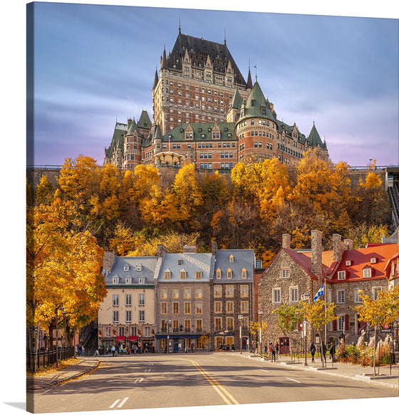 “Château Frontenac” by Wilfredo Rafael Rodriguez Hernandez invites you to a captivating journey through the charming streets of Quebec City. This exquisite print captures the iconic hotel, majestically perched atop a hill, overlooking the historic architecture of Quebec City. The artist masterfully encapsulates autumn’s golden embrace, as vibrant leaves adorn the scene with a warm, inviting glow. 