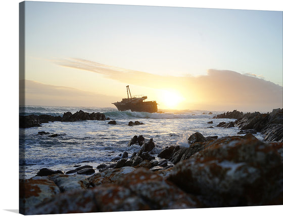 “L’Agulhas, South Africa” is a captivating print that captures the essence of the southernmost tip of Africa. The artwork portrays a breathtaking scene at L’Agulhas during sunset, where the azure waters reflect the clear skies and the rocky shores stand testament to the timeless battle between land and sea. 