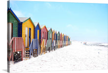  “Colorful beach huts on beach” is a vibrant and playful print that would make a great addition to any beach lover’s collection. The print features a row of wooden beach huts painted in various colors such as blue, yellow, red, and green.