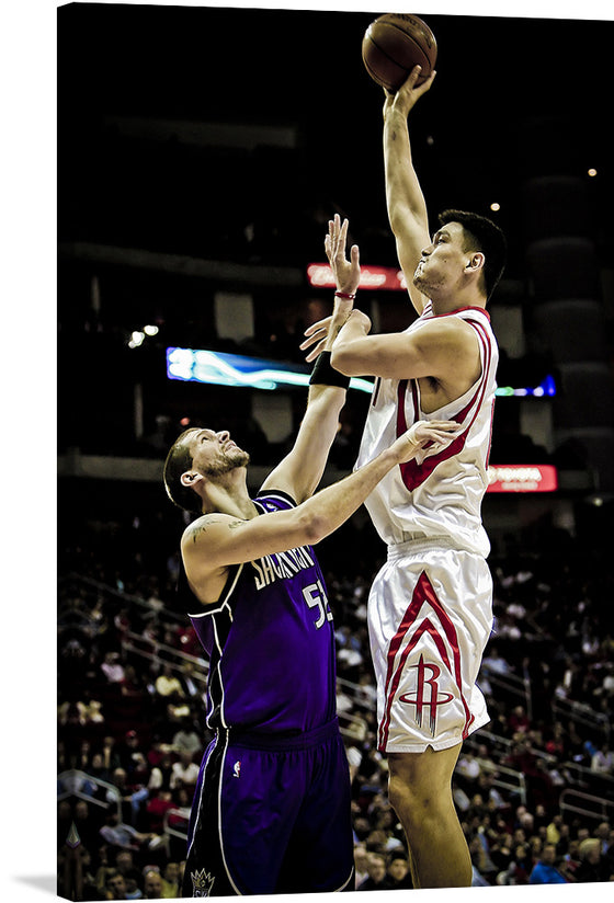 “Yao Ming shooting over Brad Miller” captures the intensity and excitement of a pivotal basketball moment. In this exclusive print, the towering Yao Ming, donning his iconic Houston Rockets jersey, rises with elegance and power. His eyes locked on the basket, he defies gravity, while Brad Miller, representing the Sacramento Kings, challenges the shot.