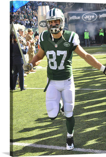  This print captures New York Jets Wide Receiver, Eric Decker, in a game against the Jacksonville Jaguars on November 8, 2015. The photo captures Decker in action, running on the field with the ball in his hand.