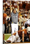 “Texas Longhorns Touchdown!” captures the heart-pounding thrill of victory on the football field. In this electrifying print, the referee’s arms shoot skyward, signaling the decisive touchdown. The clash of orange and white uniforms, the intensity etched on players’ faces, and the stadium lights illuminating the scene—it’s all here.