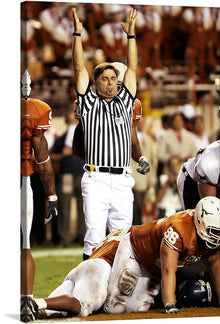  “Texas Longhorns Touchdown!” captures the heart-pounding thrill of victory on the football field. In this electrifying print, the referee’s arms shoot skyward, signaling the decisive touchdown. The clash of orange and white uniforms, the intensity etched on players’ faces, and the stadium lights illuminating the scene—it’s all here.